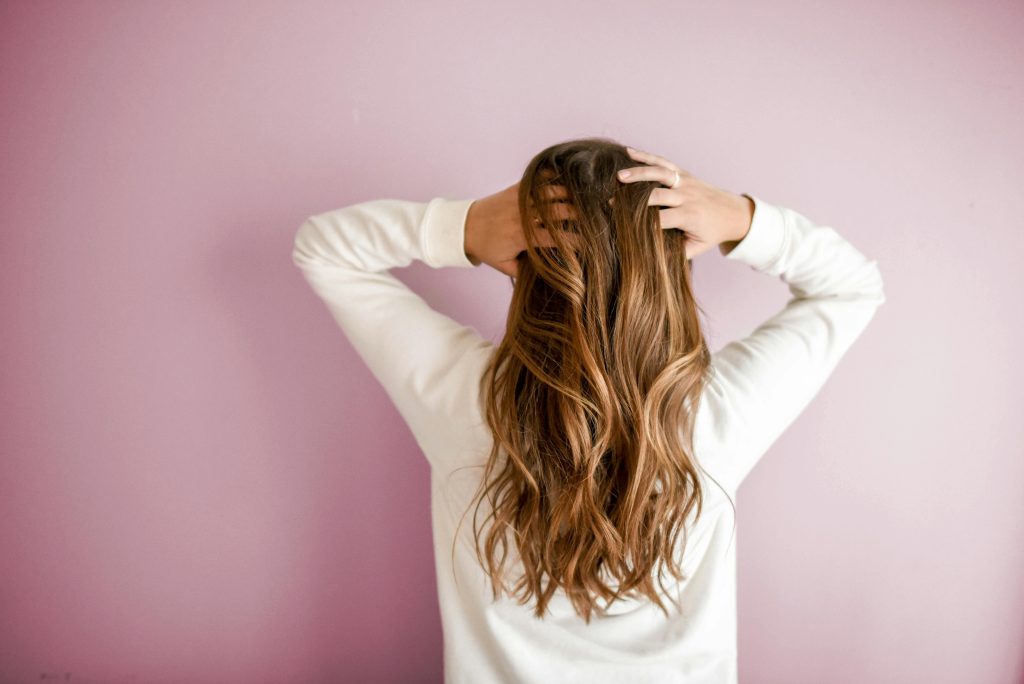 Woman holding her hair